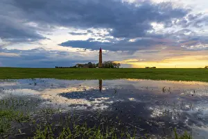 Atmospheric Evening Light Shots Prints: Sunset reflection at Flugge lighthouse