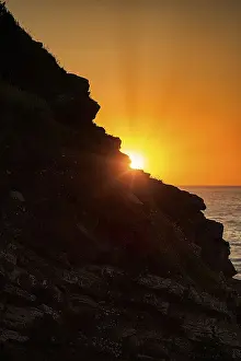 Western Europe Coastal Scenery Prints: Sunset behind rocks, Atlantic coast