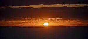 Deserted Beach Sunset Prints: Sunset over the sea, with dramatic clouds