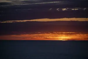 Deserted Beach Mallorca Prints: Sunset over the sea, with dramatic clouds