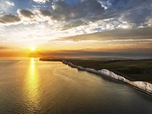 English Channel Coastline Prints: Sunset over Seven Sisters Cliffs from a drone