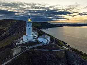 Elevated View Of Devon Coastline Prints: Sunset over Start Point Lighthouse from a drone