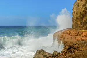 Deserted Coastline Prints: Surf on the rocks during storms