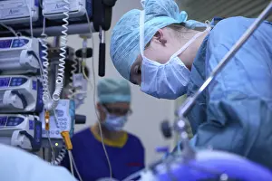 Female Doctor Profession Prints: Surgeon performing an operation