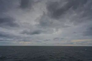 Deserted Norwegian Coastline Prints: Sweeping view of a grey, cloudy ocean