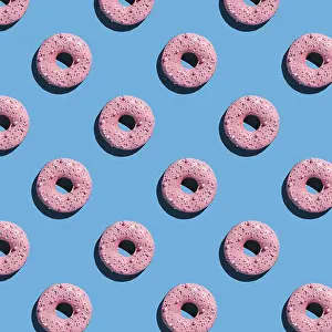 Colorful Dessert Still Life Prints: Sweet donuts pattern on a blue background