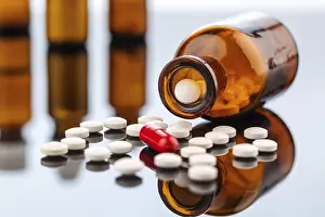 Symbolic Pill Image Prints: Many tablets with a glass container