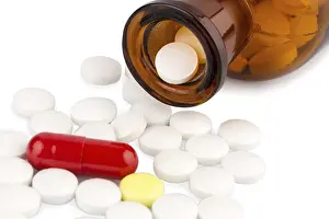 Medical Care Conceptual Image Prints: Many tablets with a glass container