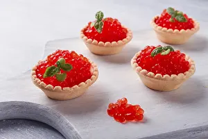 Bright Background Studio Shots Prints: Tartlets with red caviar, on a light background