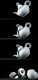 Black Background Photography Prints: Tea-Pot falling and exploding on Black Background