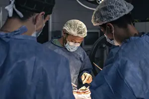 Healthcare System Images Prints: Team of doctors in an operating room
