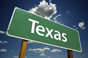 Atmospheric Billboard Image Prints: Texas road sign with dramatic clouds and sky