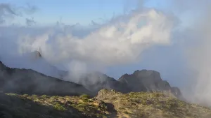 Eroded Canyon Scenery Prints: Thick clouds surround the mountain peaks