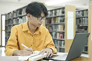 University Study Environment Prints: Thoughtful Young Student Preparing for Class