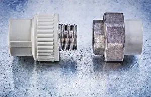 Construction Equipment Prints: Threaded pipe connectors on metallic background construction concept