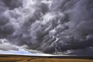 American National Park Scenery Prints: The thundercloud and lightning above boundless plain in state of Idaho