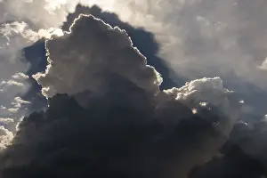 Cumulus Humilis Clouds Prints: Thunderclouds, Altocumulus, sun behind grey clouds