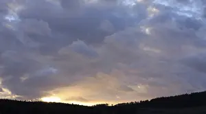 Cloudy Atmosphere Prints: Thunderclouds above a dark landscape