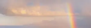 Cloudy Evening Atmosphere Prints: Thunderclouds in evening light with rainbow