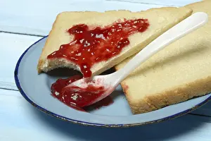 Raspberry Jam Toast Prints: Toast with raspberry jam on a plate, breakfast