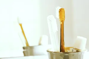 Dental Care Prints: Toothbrushes and toothpaste in a glass in front of a mirror