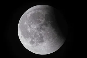 Prints of After a total lunar eclipse, the moon appears shortly after its rise in the evening sky as a so-called blood moon in front of it then begins to emerge from the Earth's umbra, Frankfurt am Main Umbra Prints: After a Total Lunar Eclipse - Blood Moon Print