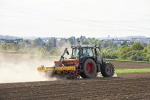German Agricultural Machinery Prints: Tractor with seed drill in the field in spring