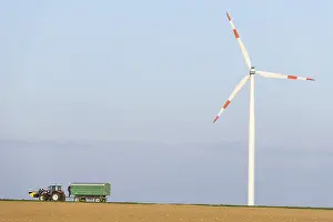 Wind Turbine Germany Prints: Tractor with trailer in a field