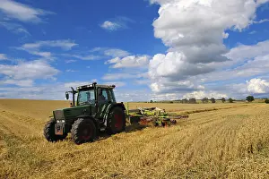 Cereal Cultivation Germany Prints: Tractor working in a cereal field