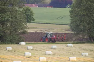 Northern Germany Countryside Prints: A tractor working in the field
