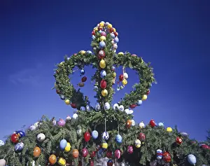 Traditional German Easter Decoration Prints: A traditionally decorated Easter tree with colourful Easter eggs under a clear blue sky