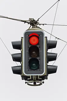Deserted Road Prints: A traffic light with a red light
