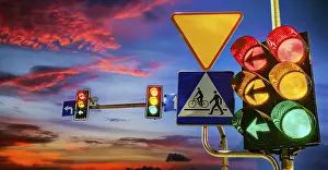 Urban Evening Atmosphere Prints: Traffic lights over urban intersection