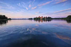 Prints of Trakai Island Castle in lake Galve, Lithuania on sunset with reflection in water, Trakai Castle is one of major tourist attractions of Lituania Lake Prints: Trakai Island Castle Print at Sunset, Lithuania