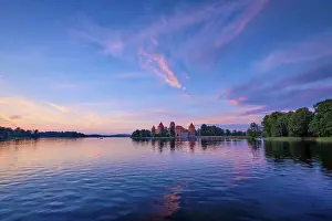 Prints of Trakai Island Castle in lake Galve, Lithuania on sunset with dramatic sky reflecting in water, Trakai Castle is one of major tourist attractions of Lituania, now museum and cultural center, Europe Lake Prints: Trakai Island Castle Print, Lithuania at Sunset