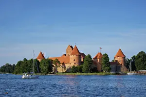 Prints of Trakai Island Castle in lake Galve with boats in summer day, Lithuania. Trakai Castle is one of major tourist attractions of Lituania Lake Prints: Trakai Island Castle Print, Lithuania