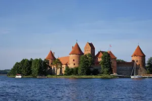 Prints of Trakai Island Castle in lake Galve with boats in summer day, Lithuania. Trakai Castle is one of major tourist attractions of Lituania Lake Prints: Trakai Island Castle Print, Lithuania