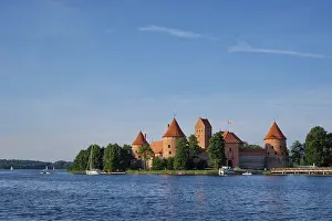 Prints of Trakai Island Castle in lake Galve with boats and yachts in summer, day with beautiful sky, Lithuania Lake Prints: Trakai Island Castle Print, Lithuania Summer Scene