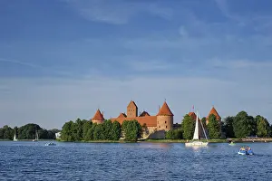 Prints of Trakai Island Castle in lake Galve with boats and yachts in summer day with beautiful sky, Lithuania. Trakai Castle is one of major tourist attractions of Lituania Lake Prints: Trakai Island Castle Print, Lithuania