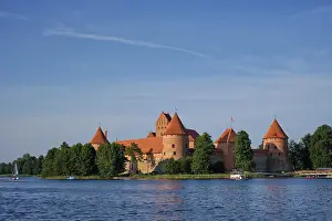 Prints of Trakai Island Castle in lake Galve with boats and yachts in summer day with beautiful sky, Lithuania. Trakai Castle is one of major tourist attractions of Lituania Lake Prints: Trakai Island Castle Print, Lithuania