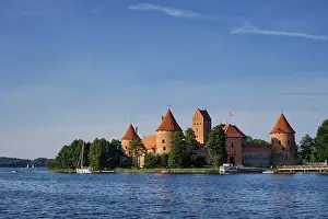 Prints of Trakai Island Castle in lake Galve with boats and yachts in summer day with beautiful sky, Lithuania. Trakai Castle is one of major tourist attractions of Lituania Lake Prints: Trakai Island Castle Print, Lithuania
