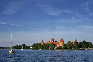 Prints of Trakai Island Castle in lake Galve with boats and yachts in summer day with beautiful sky, Lithuania. Trakai Castle is one of major tourist attractions of Lituania Lake Prints: Trakai Island Castle Print, Lithuania