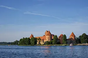Prints of Trakai Island Castle in lake Galve with boats and yachts in summer day with beautiful sky, Lithuania. Trakai Castle is one of major tourist attractions of Lituania Lake Prints: Trakai Island Castle Print, Lithuania