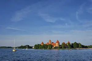 Prints of Trakai Island Castle in lake Galve with boats and yachts in summer day with beautiful sky, Lithuania, Trakai Castle is one of major tourist attractions of Lituania Lake Prints: Trakai Island Castle Print, Lithuania