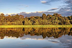 Evening Water Reflections Prints: Tranquil scene of a river with trees and cloud reflections