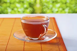 Hot Beverage Photography Prints: Transparent cup with tea on table