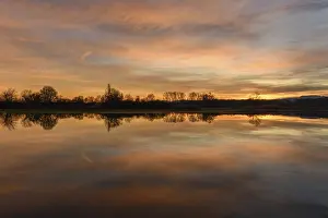 Sunset Winter Scene Prints: Trees reflected in the water at sunset