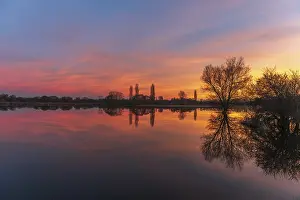Trees Reflected In Water Prints: Trees reflected in the water at sunset