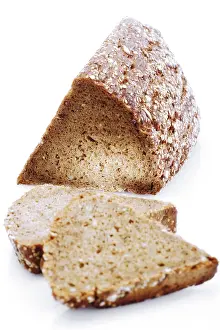 Studio Shot Bread Prints: Triangular loaf and slices of wholegrain bread