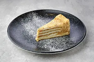 French Cuisine Prints: Triangular piece of classic Napoleon cake on a plate